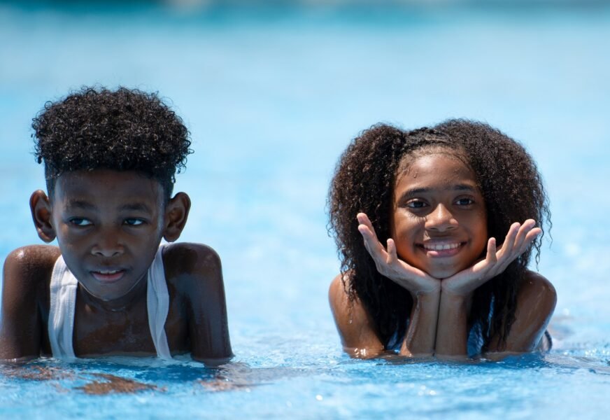 African,Girls,Lay,Down,In,Swimming,Pool.,Concept,Children,Self